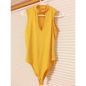 Women’s yellow bodysuit